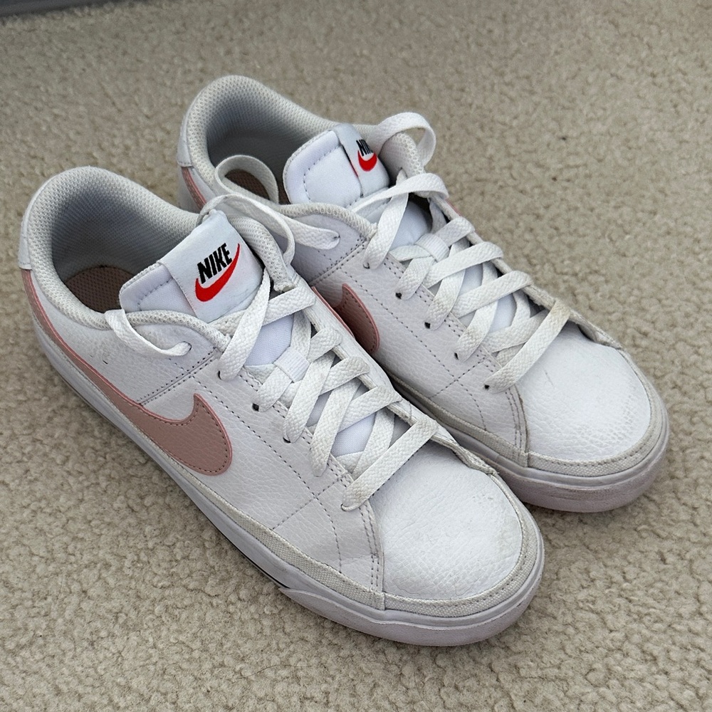Nike Women’s White Low-Top Sneakers with Pink Swoosh